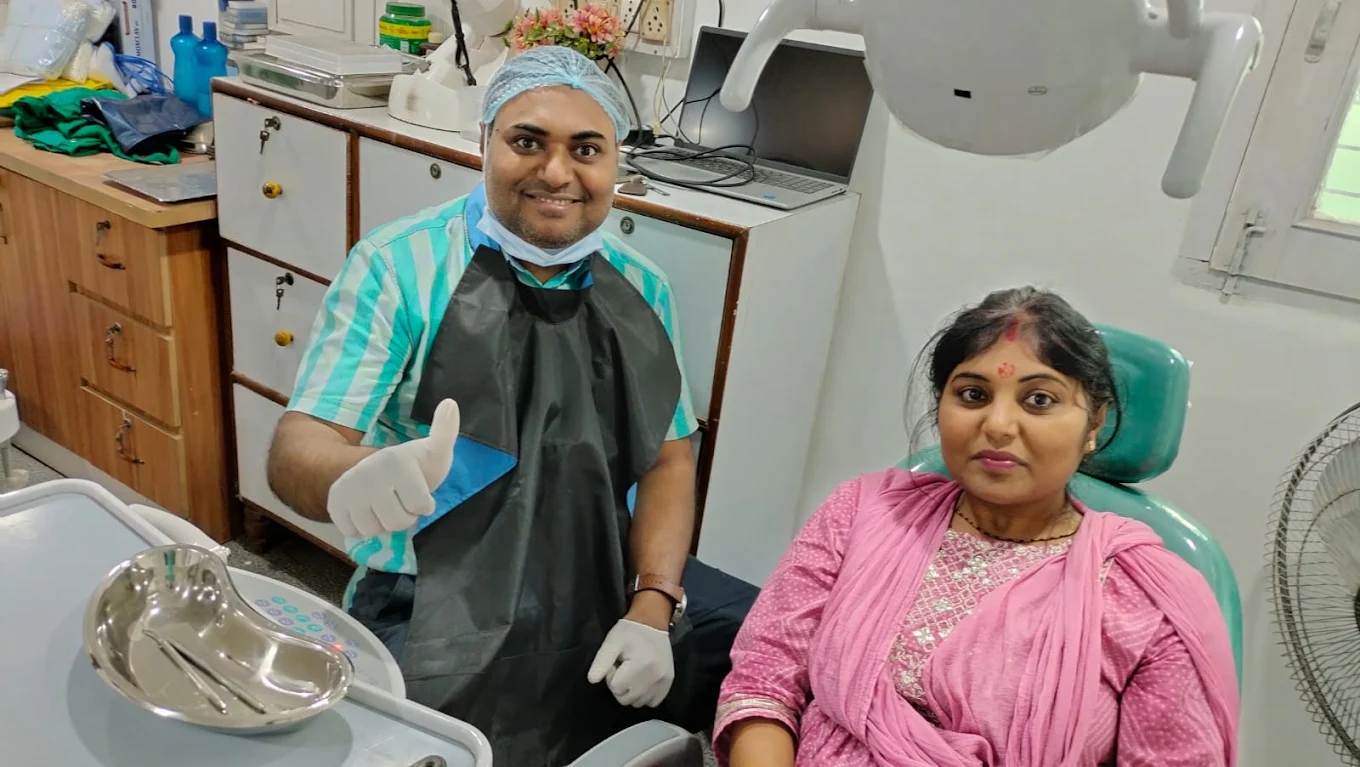 Patient with dentist at clinic